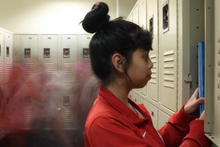 Eighth+grader+Jennifer+Lopez+poses+looking+through+her+locker.+In+the+whirl+of+%0Aeveryday+school+life%2C+students+can+feel+overlooked.