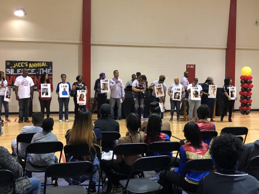 Angel Moms stand at activist Mrs. Stacie Paynes Silence the Violence Stop Gun Violence Rally with a picture of their loved who unfortunately died due to gun violence. These people stood up in a room full of people to tell their loved ones stories.