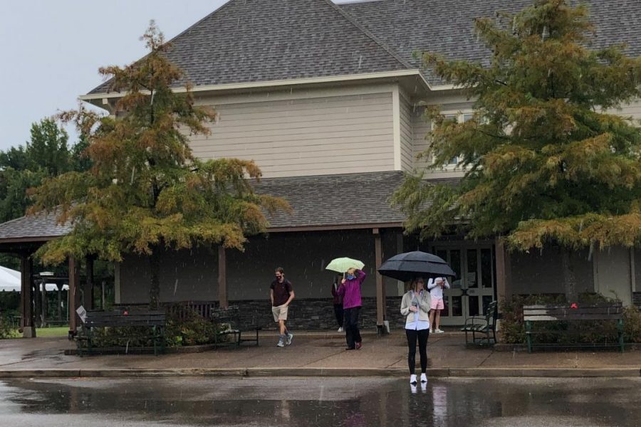 Teachers stand in the parking lot to ensure that students dismiss in an orderly fashion. Grade levels were released gradually, starting with seniors and ending with freshmen.