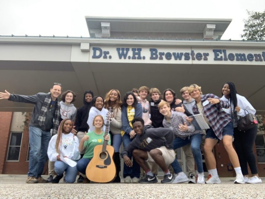Mr. Hills stands with members of the Institute for Citizenship in front of Dr. W.H. Brewster Elementary School, which was the site of a service project last year. Mr. Hills had to rely on the members to find the focus of their service this year. Photo courtesy of Joy Huff.