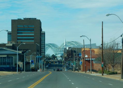 The Hernando de Soto Bridge is framed between several buildings on Poplar Avenue. Memphis was one of several cities that was hit hard amid shut downs of businesses during the COVID-19 pandemic.