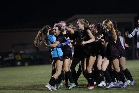 The team celebrates Mary Beth Skelton’s penalty kick win against Lausanne.