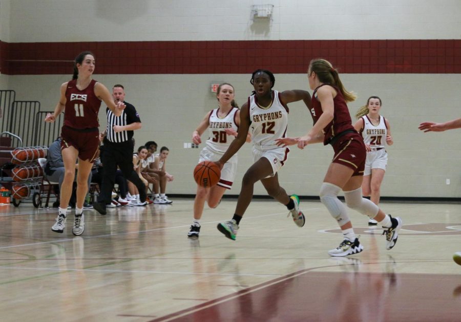 Aaliyah Converse ‘24 brings the ball upcourt in the girls’ game against Harding.