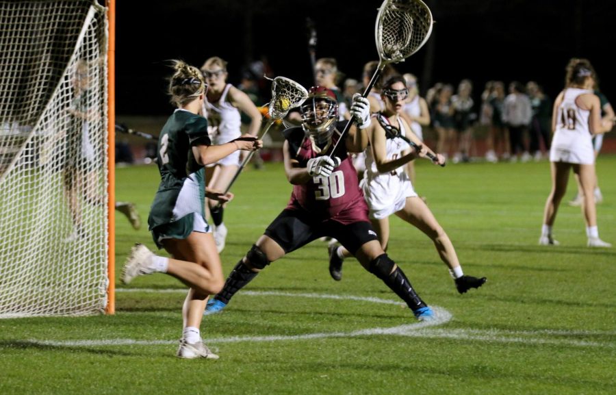 Trinity Cannon ‘23 steps up to defend the goal against a Briarcrest attacker. 