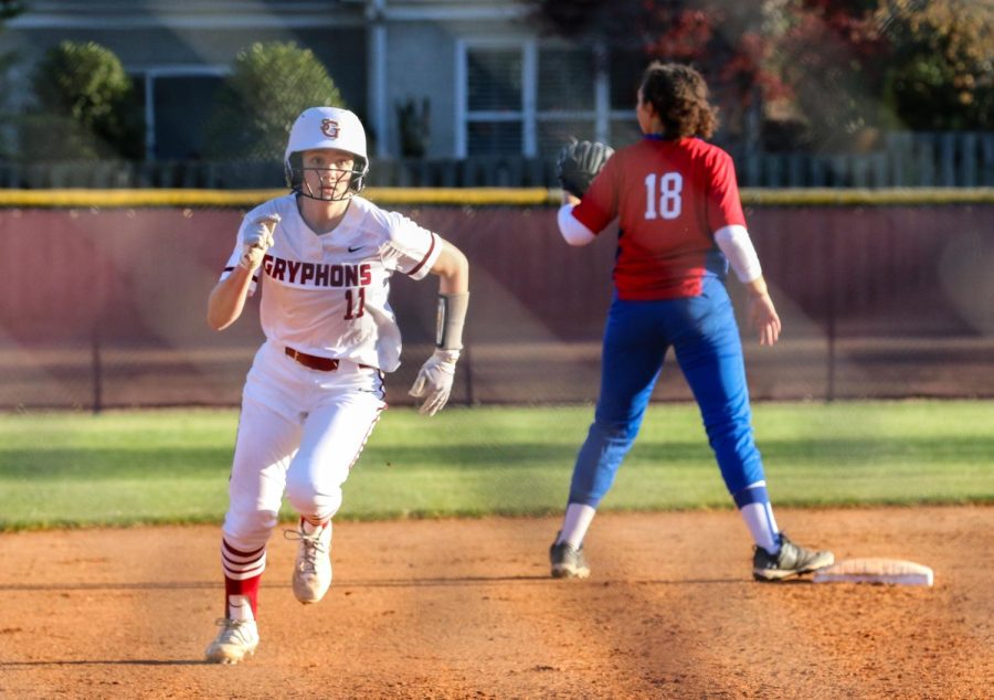 Gracye Thompson ‘24 runs for home during a win against Harding.