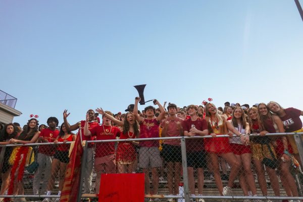 The Gryphon student section enjoys their first home game back in the bleachers, led by the new bleacher creatures.
