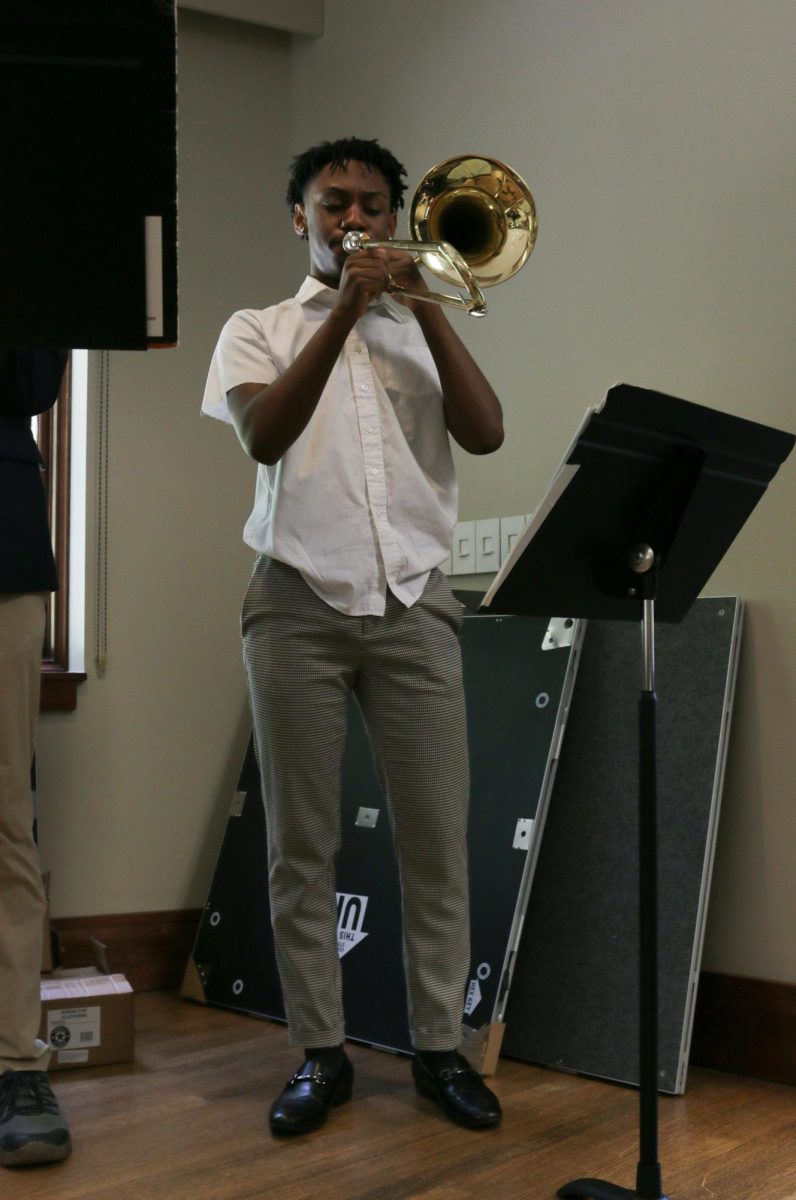 Senior Eli Palmer plays the trombone during the AME pop-up lunch on Tuesday, Oct. 3. 
