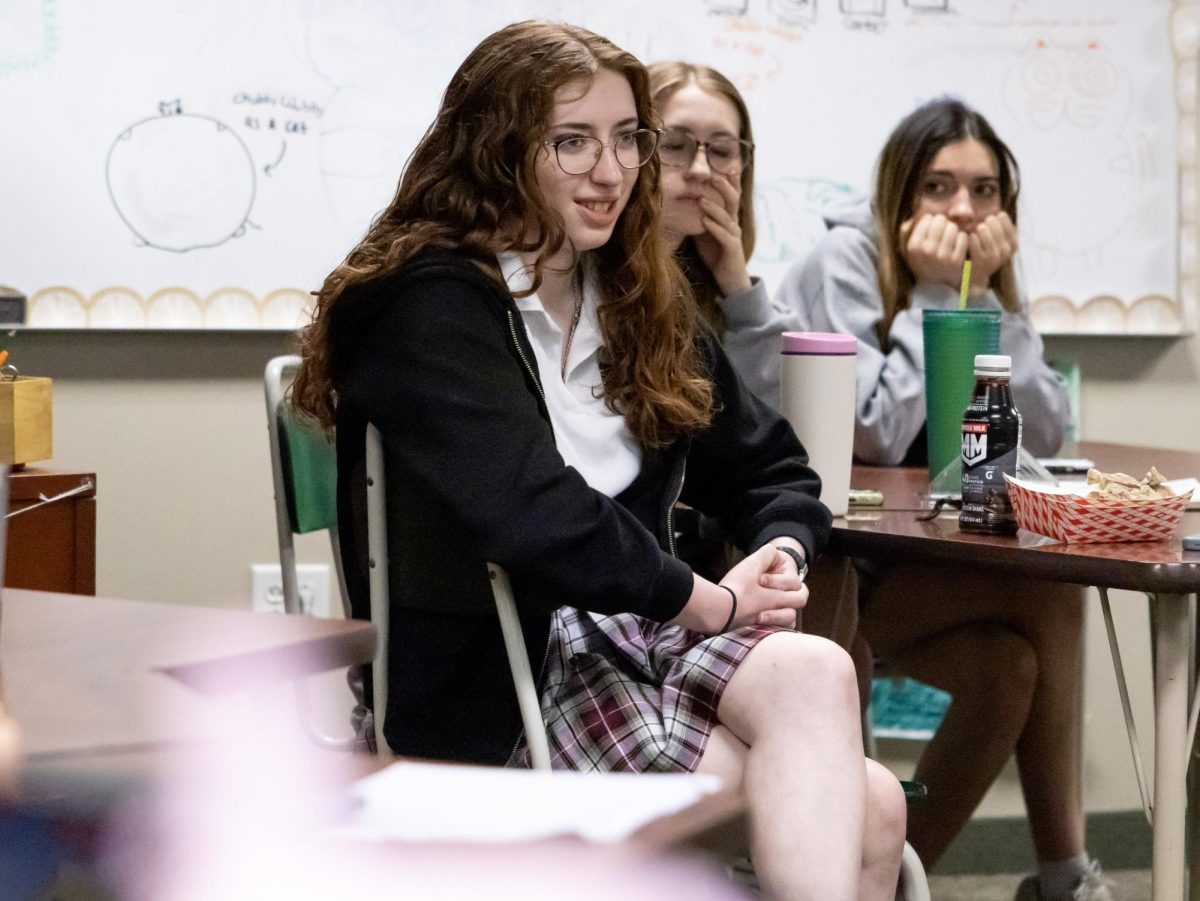 Senior Elena Sallee engaging in conversation during the public forum on Tuesday, April 2, 2026. As History Club President, she moderated the discussion.