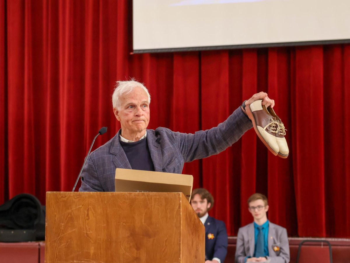 Mr. Rick Ferguson displays shoes during a chapel radio spot on Tuesday, April 7, 2026. Mr. Ferguson used a story from his past to emphasize the importance of taking healthy risks.
