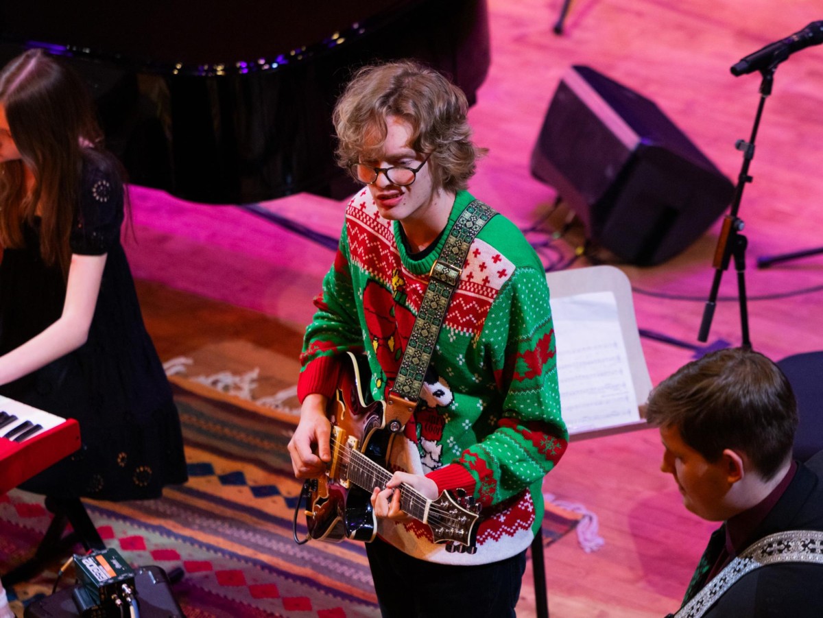 Alex Smith ‘25 performs during the “Christmas at the Scheidt” event at the Scheidt Performing Arts Center on Dec. 5, 2026. Smith played lead guitar in American Music Ensemble.